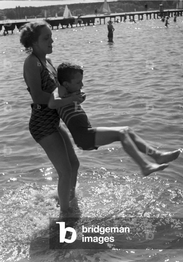 Mother and son at lake Wannsee lido in Berlin, Germany 1930s (b/w photo)