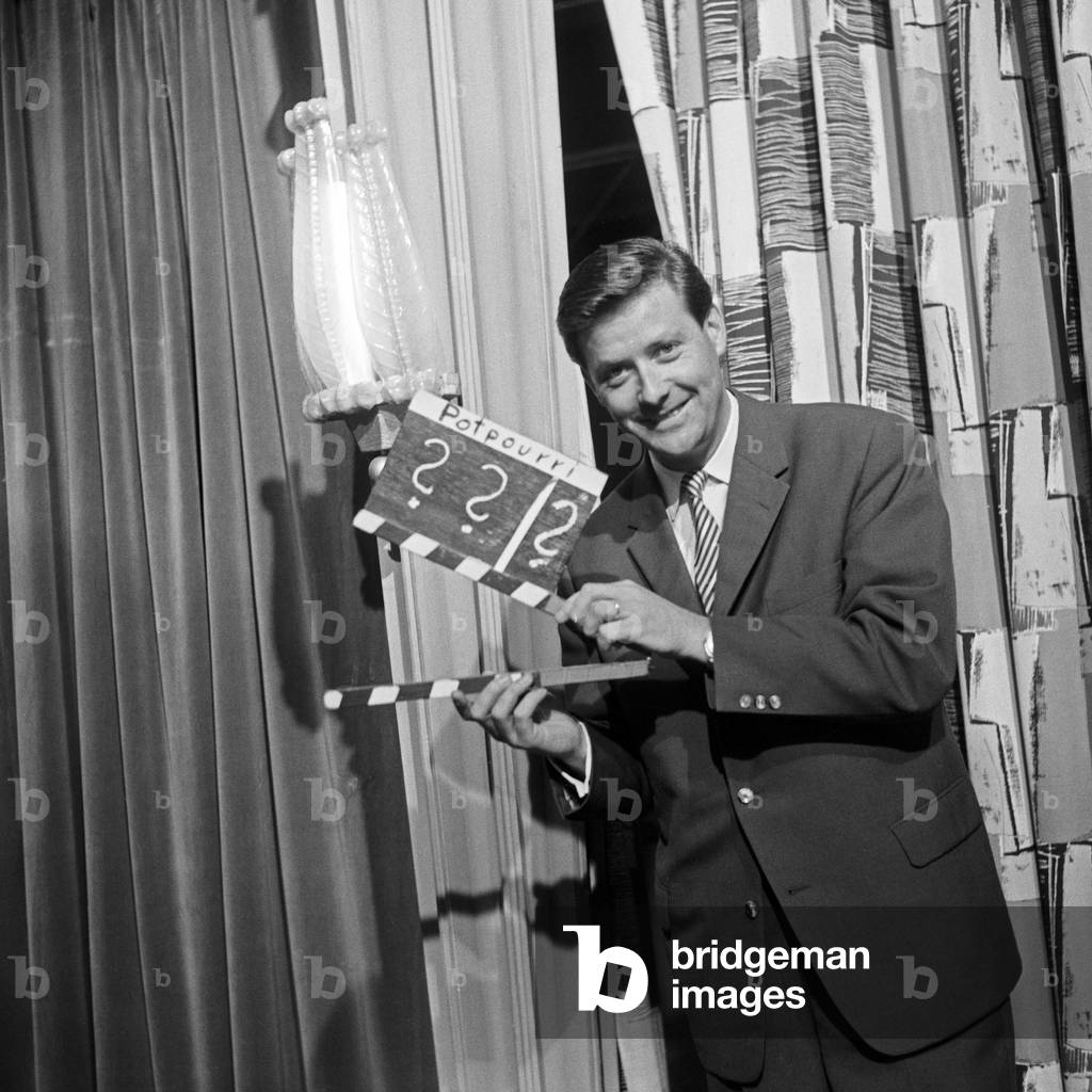 Swiss journalist Guido Baumann with a clapperboard, Germany 1950s