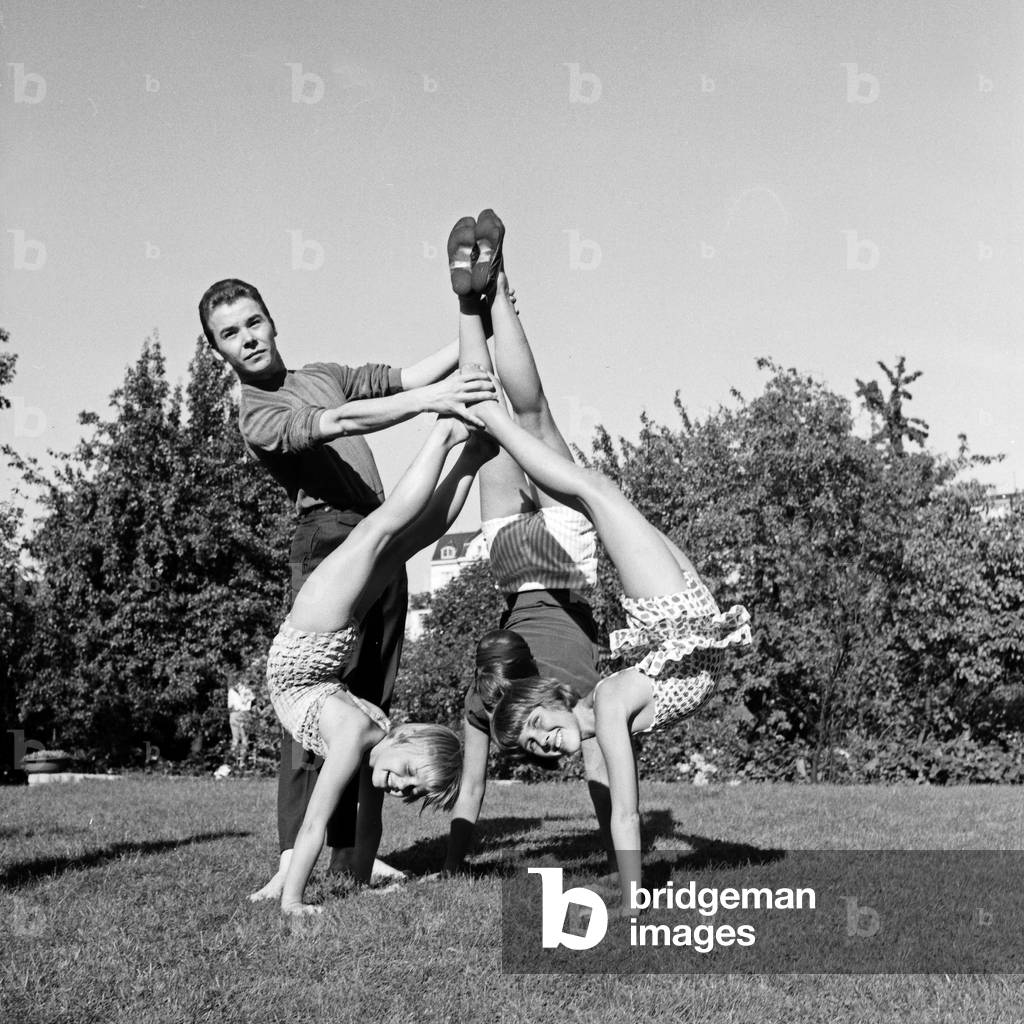 Children of Friedel Finke-Grieg's dancing school doing gymnastics at a park in Hamburg, Germany 1960s