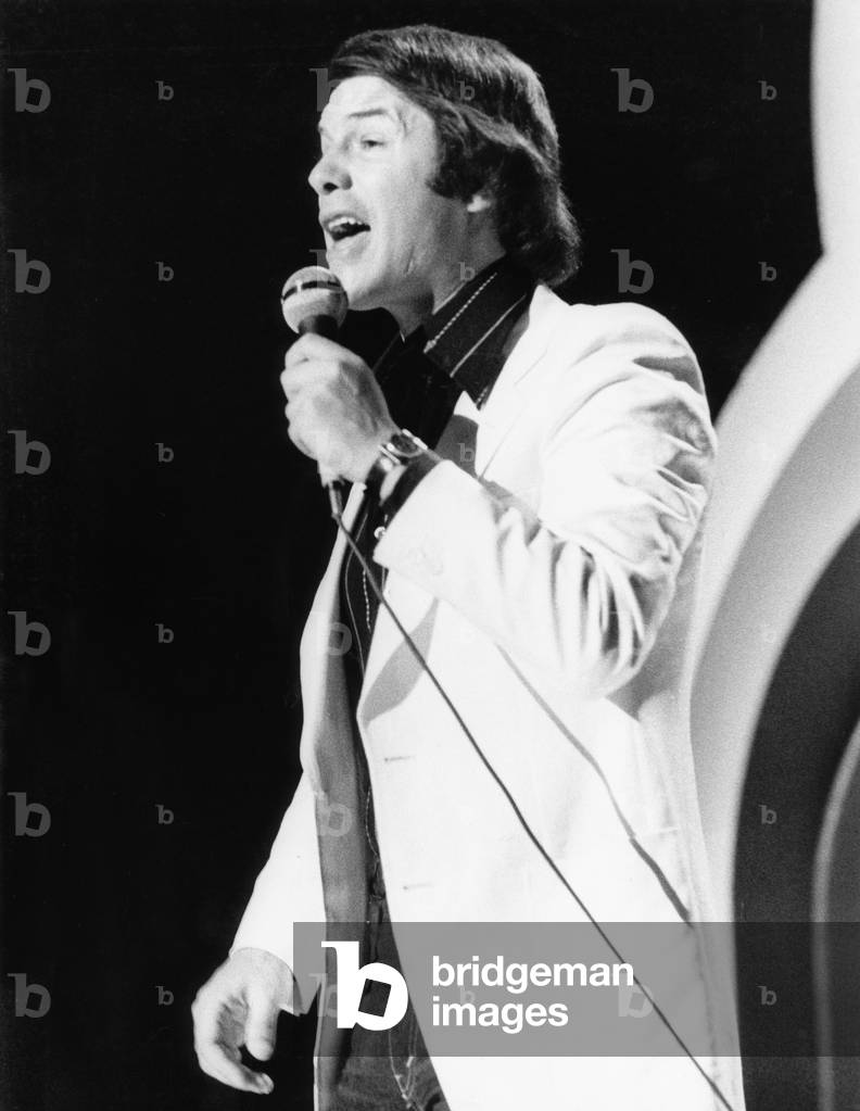 Belgian musician, songwriter and singer Salvatire Adamo singing in a TV show on October 3th, 1977