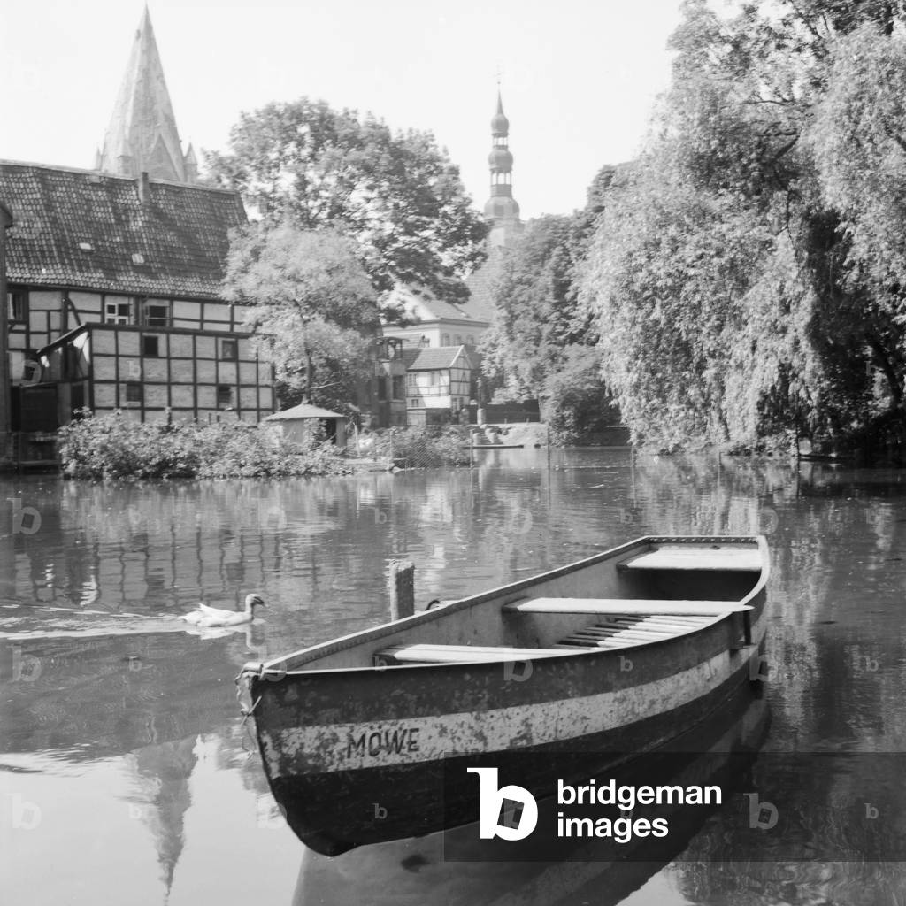 A rowing boat lying on the water at Soest in Westfalia, Germany 1930s (b/w photo)