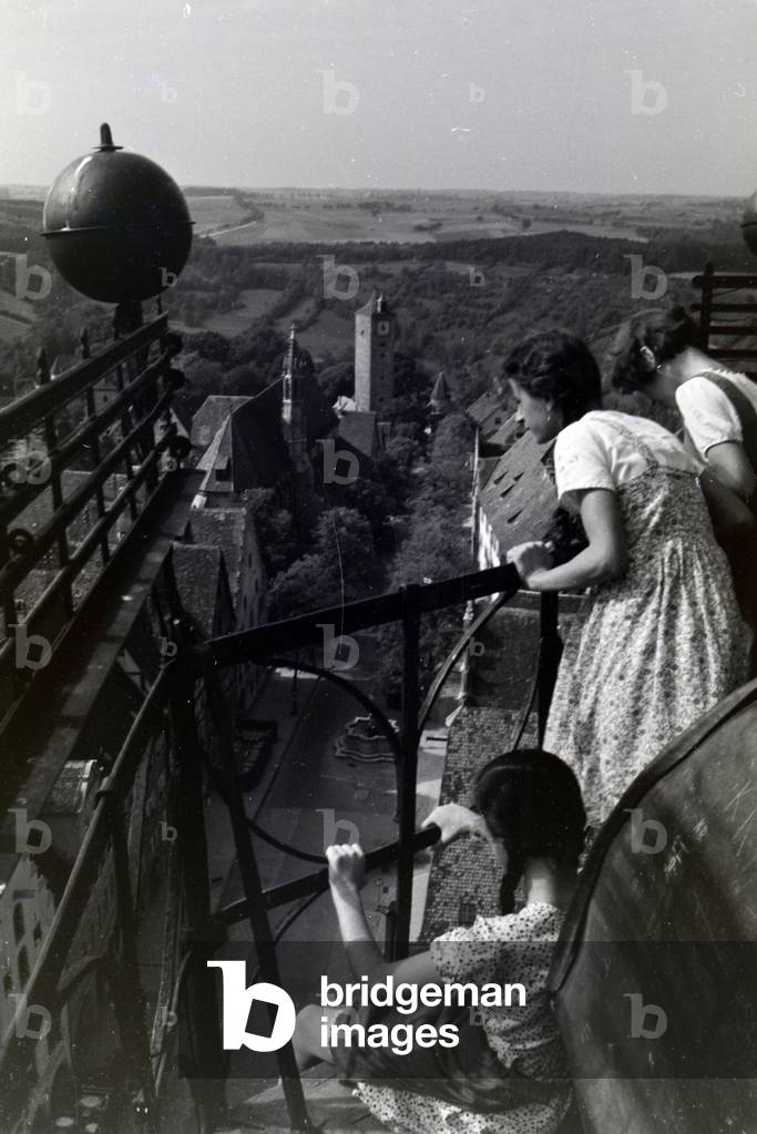 The highest tower of the townhall presents an excellent view over the whole city center and the surrounding natural landscapes of Rothenburg ob der Tauber, Germany 1930s (b/w photo)