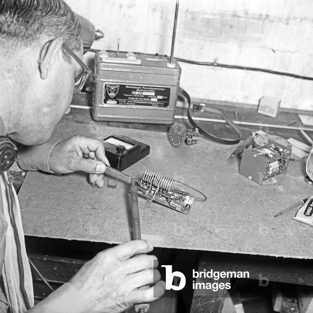 Eletronic check while constructiong a model plane at Hamburg, Germany 1950s