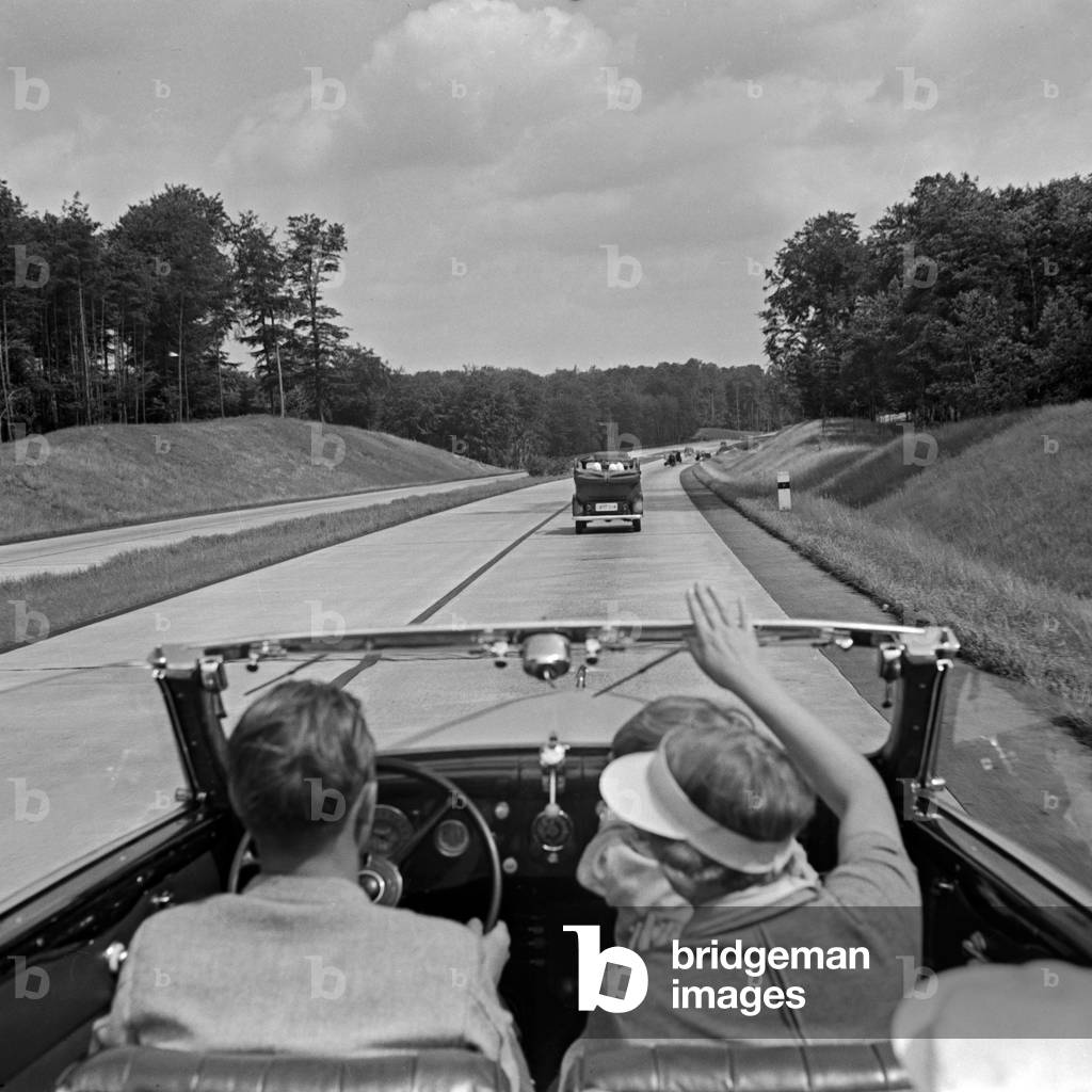 On the highway between Berlin and Stettin with the Ford V8 convertible, Germany 1930s (b/w photo)