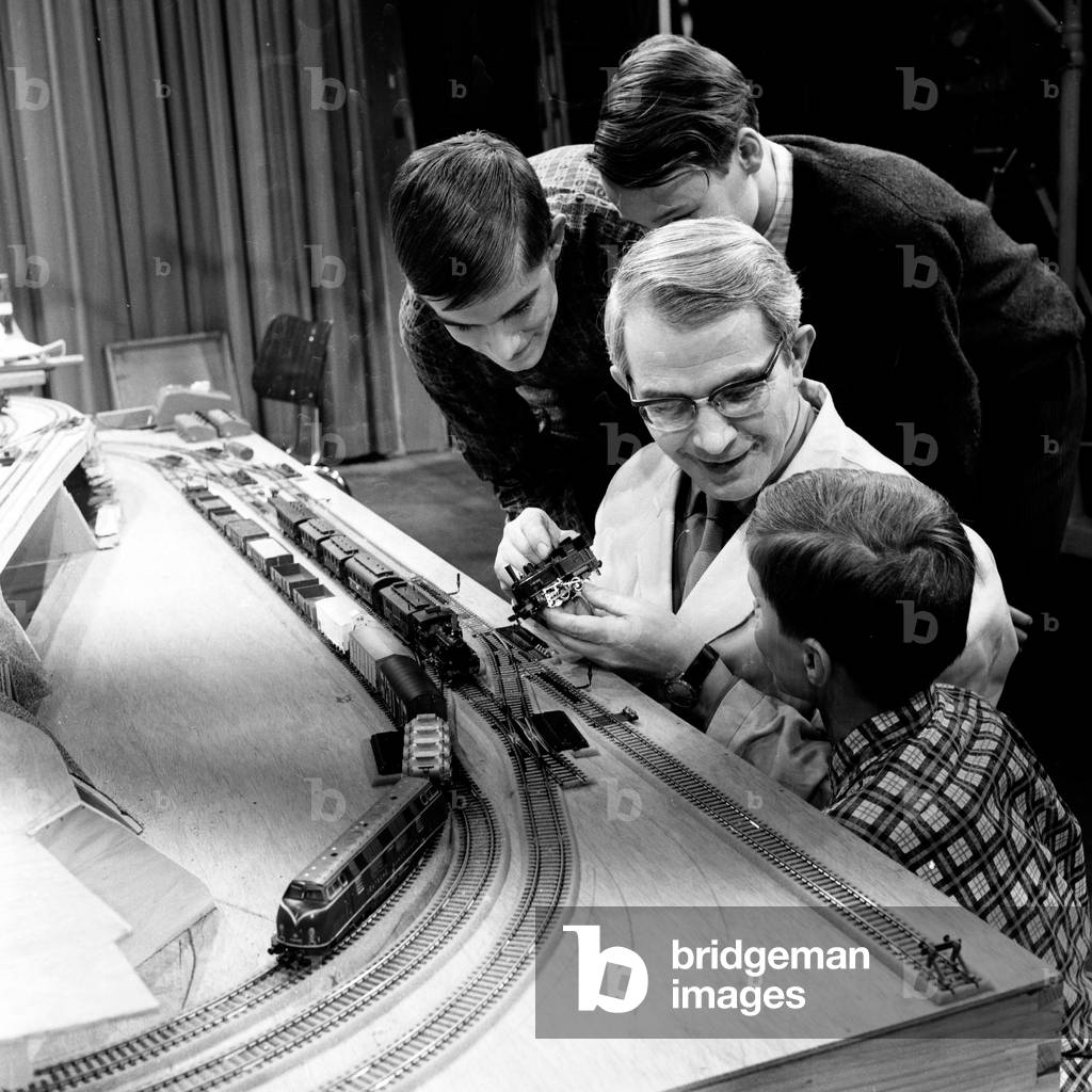 Presenter Friedrich Karl Ries showing model trains at his show 