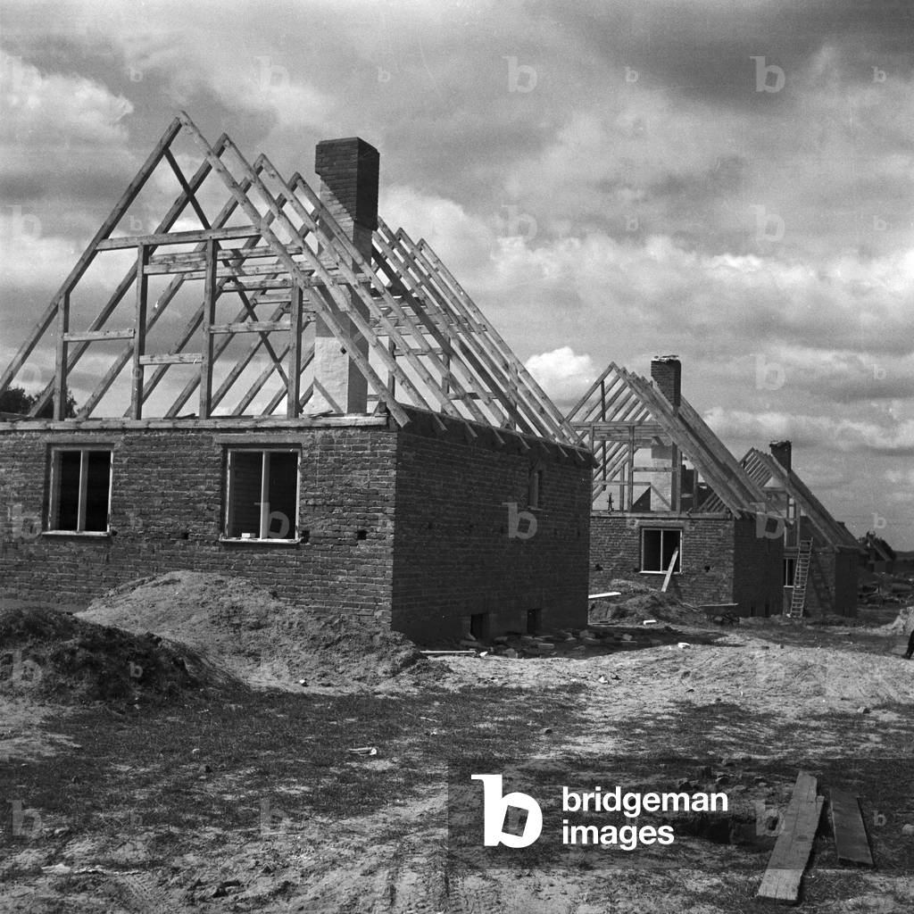 Serial houses under construction at Johannisburger Strasse street at Allenstein in East Prussia, Germany 1930s (b/w photo)