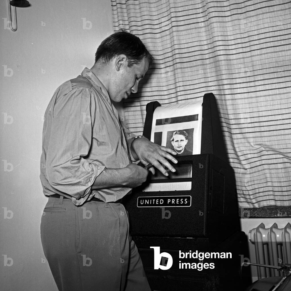 German TV director Juergen Roland in the office at the teletyper, Germany 1950s