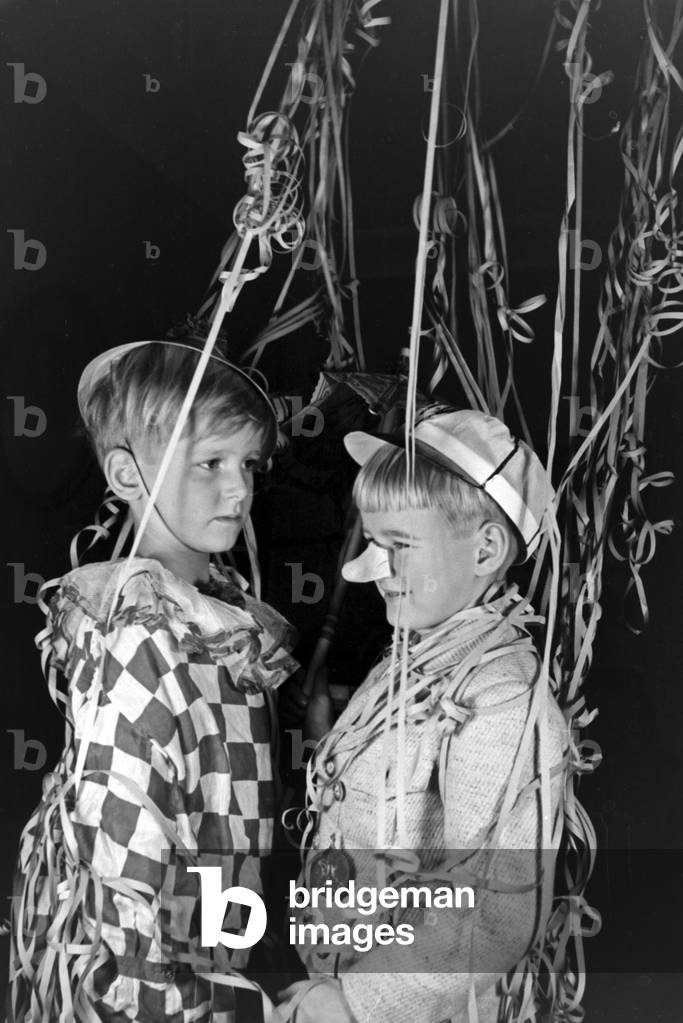 Two little boys dressed for a carnival, Germany 1930s (b/w photo)