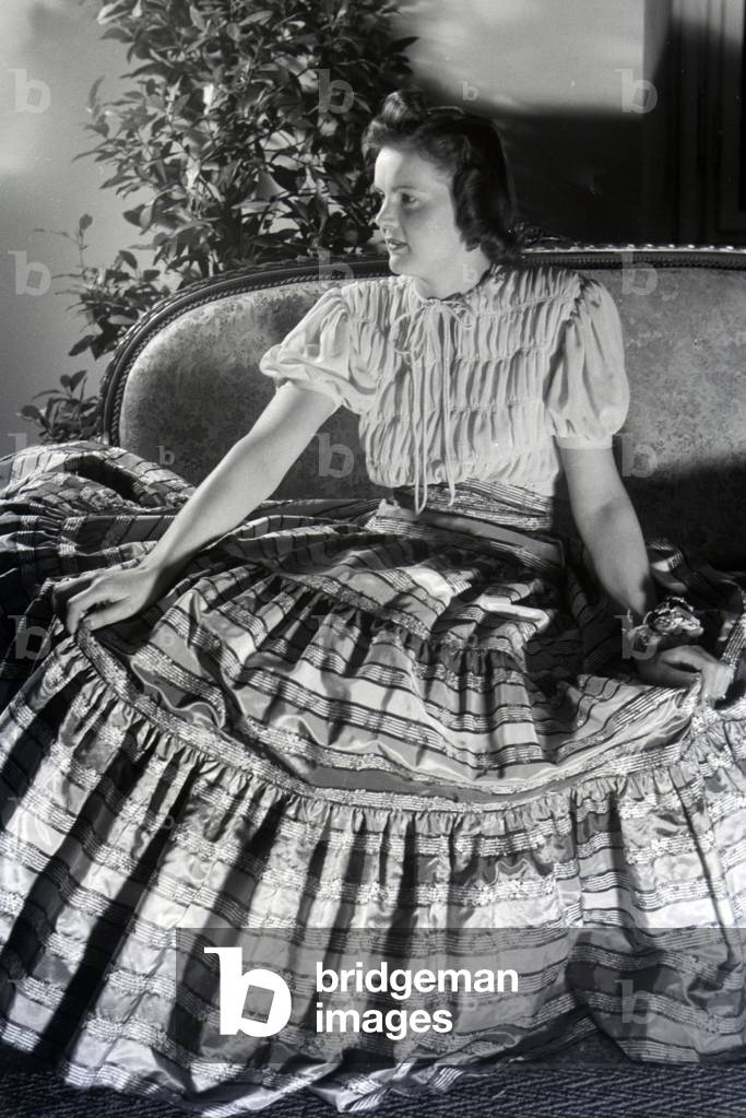 A model is presenting a folkloristic dress, on the occasion of the Wiener Modewoche in the house of fashion 