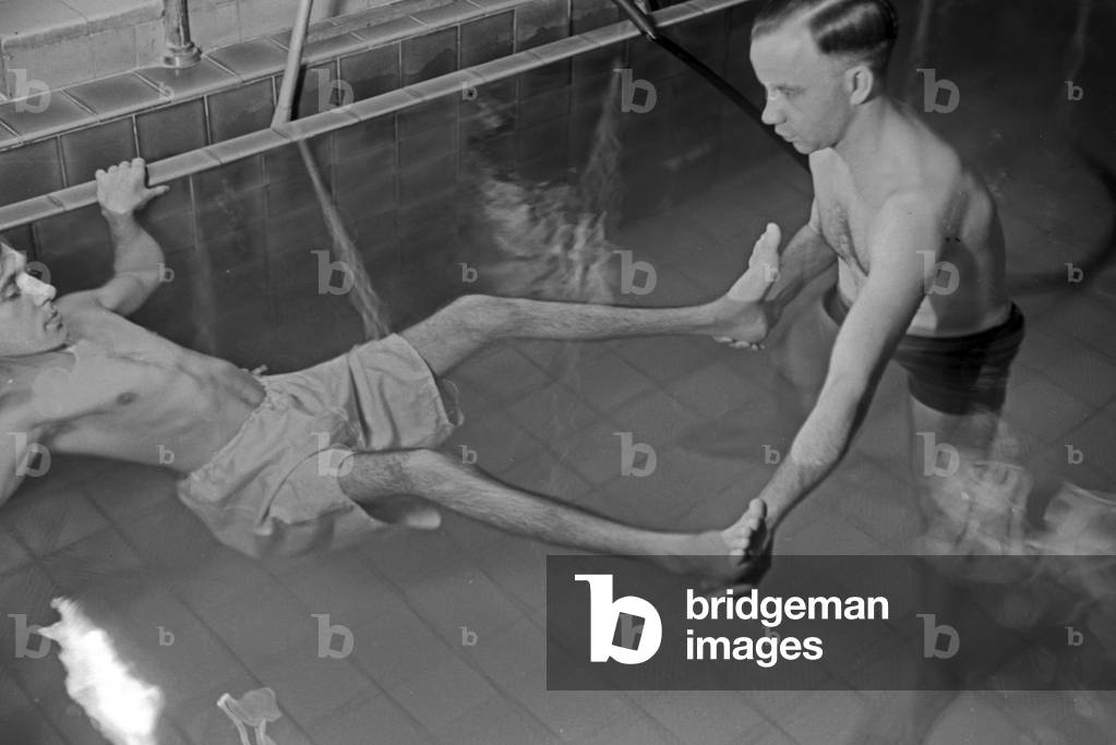 A patient in a therapeutic bath, Germany 1930s (b/w photo)