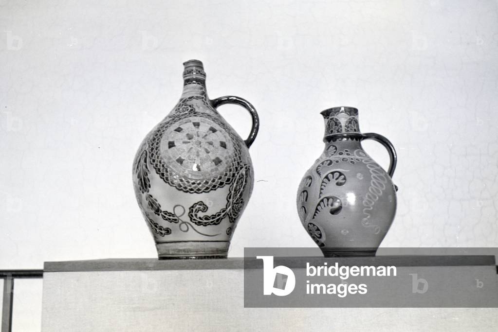 Two finished vases with a fancy ornamental painting, produced by the students of the College for Ceramics in Höhr-Grenzhausen, Germany 1930s (b/w photo)