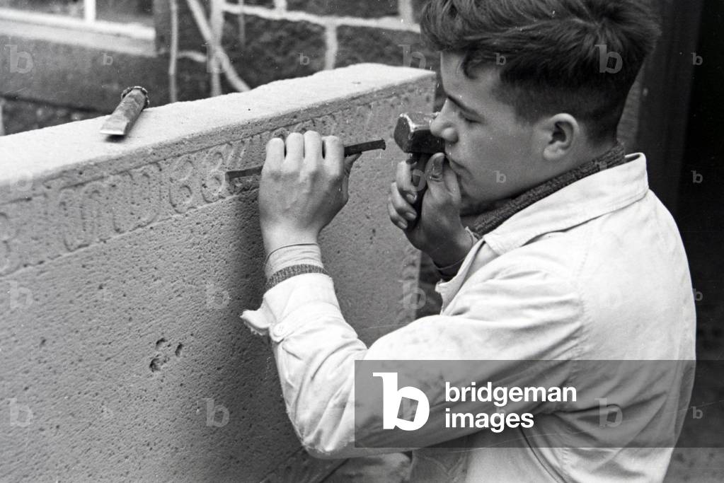 Trainee of a chiseller school at a tutorial, Germany 1937 (b/w photo)