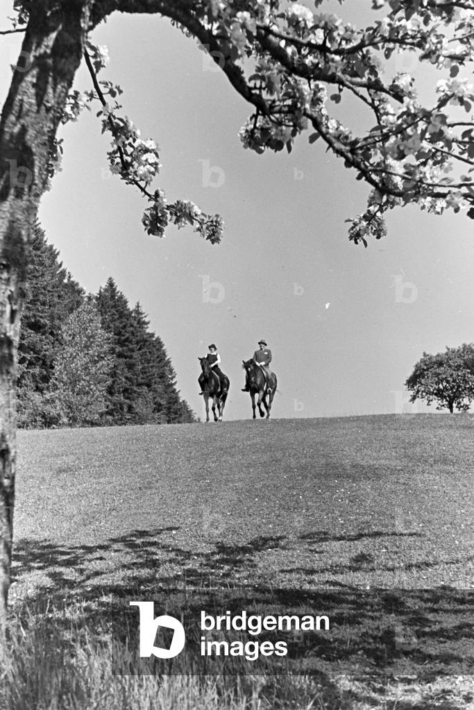 Riders on a horse-riding trip in the woods near Freudenstadt, Germany 1930s (b/w photo)