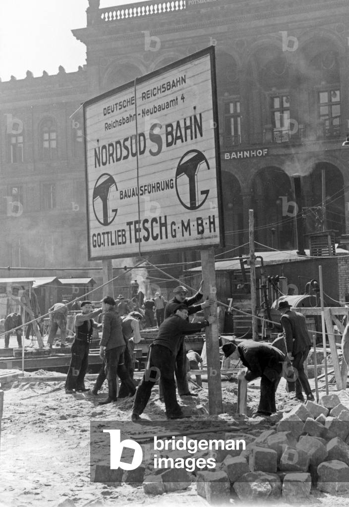 Official information sign about the construction area of the North South connection of Berlin tram, Germany 1930s (b/w photo)