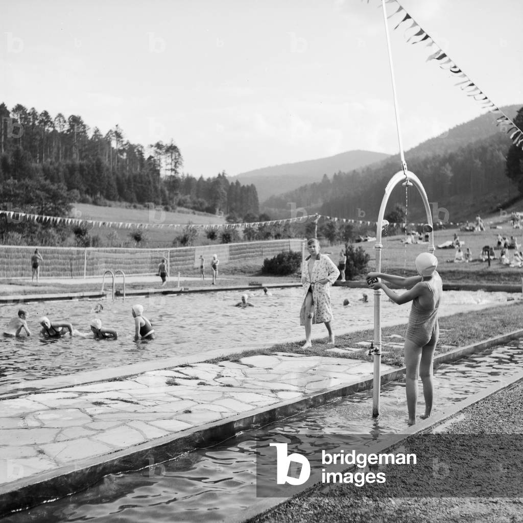 People at a public pool, Germany 1930s (b/w photo)