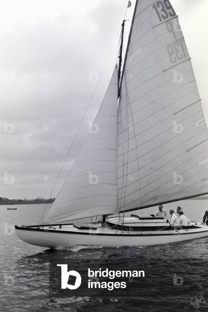 A group of sailors floating over the Chiemsee in a boat, Germany 1930s (b/w photo)