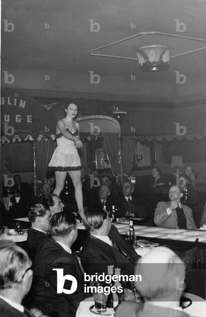 A young woman on the catwalk of a nightclub at Hamburg Reeperbahn, 1950s