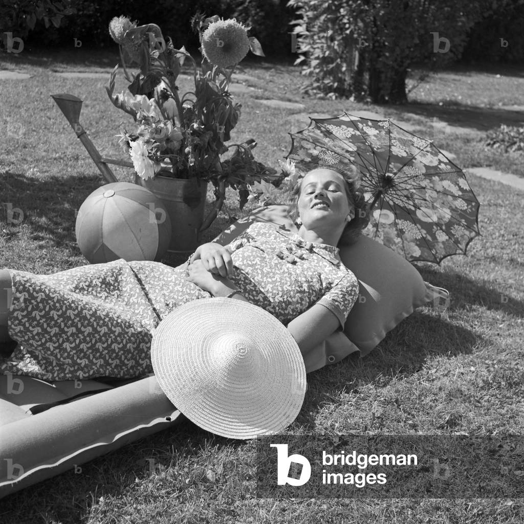 A young woman on a lawn, Germany 1930s (b/w photo)