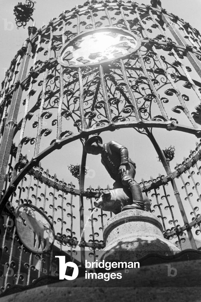 A fountain with the sculpture of a pig in Stuttgart, Germany 1930s (b/w photo)