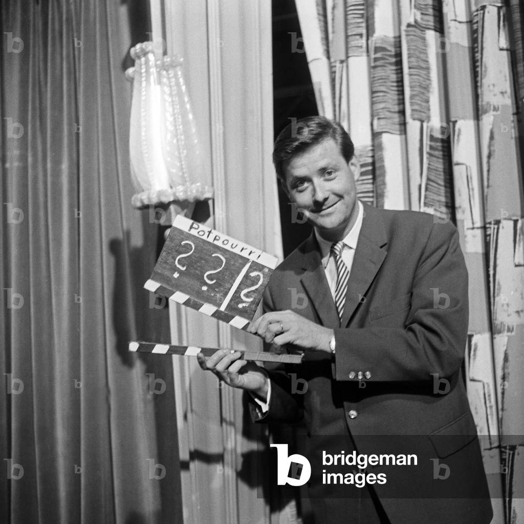 Swiss journalist Guido Baumann with a clapperboard, Germany 1950s