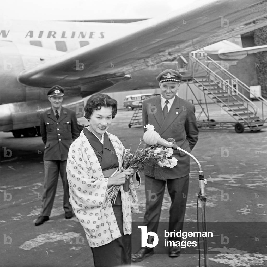 Female Japanese singer Butterfly arrives at Hamburg airport, Germany 1950s