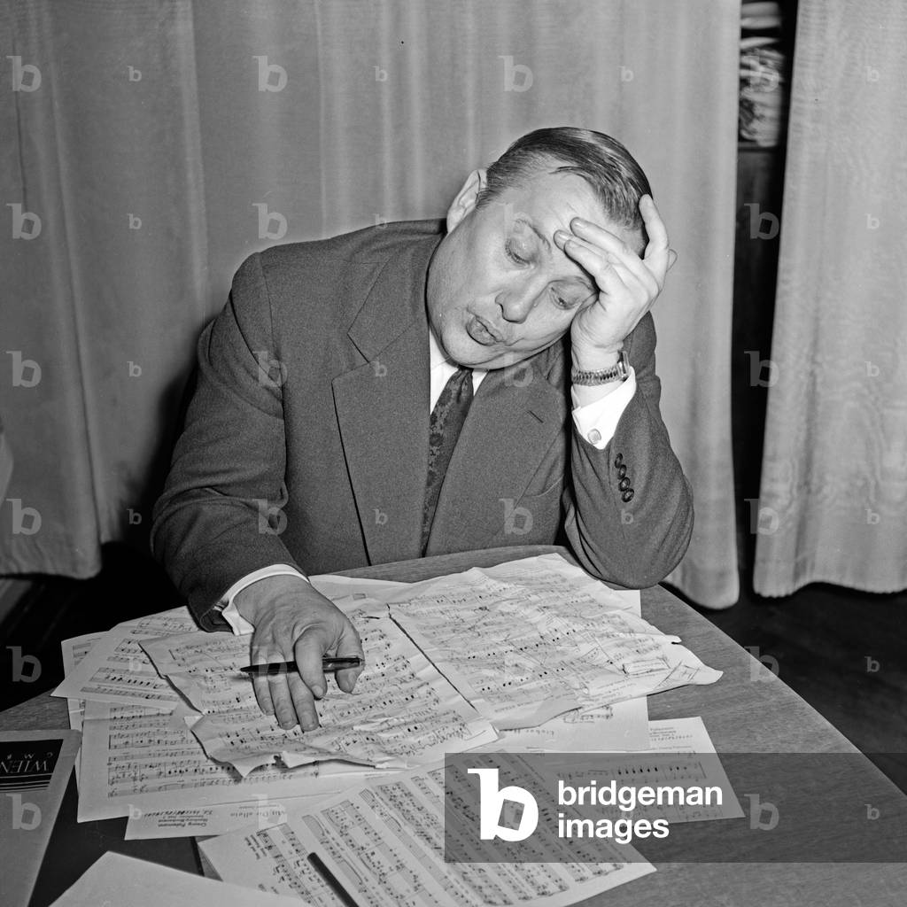 A composer trying to arrange a compsition at Hamburg, Germany 1950s