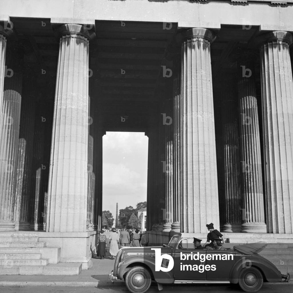 An Opel model Admiral coming to Koenigsplatz square at Munich, Germany 1930s (b/w photo)
