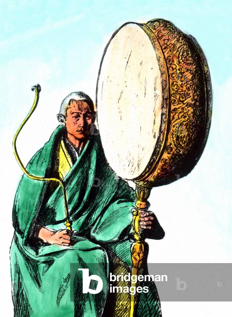 Monks in Tibet playing instruments for their prayer service