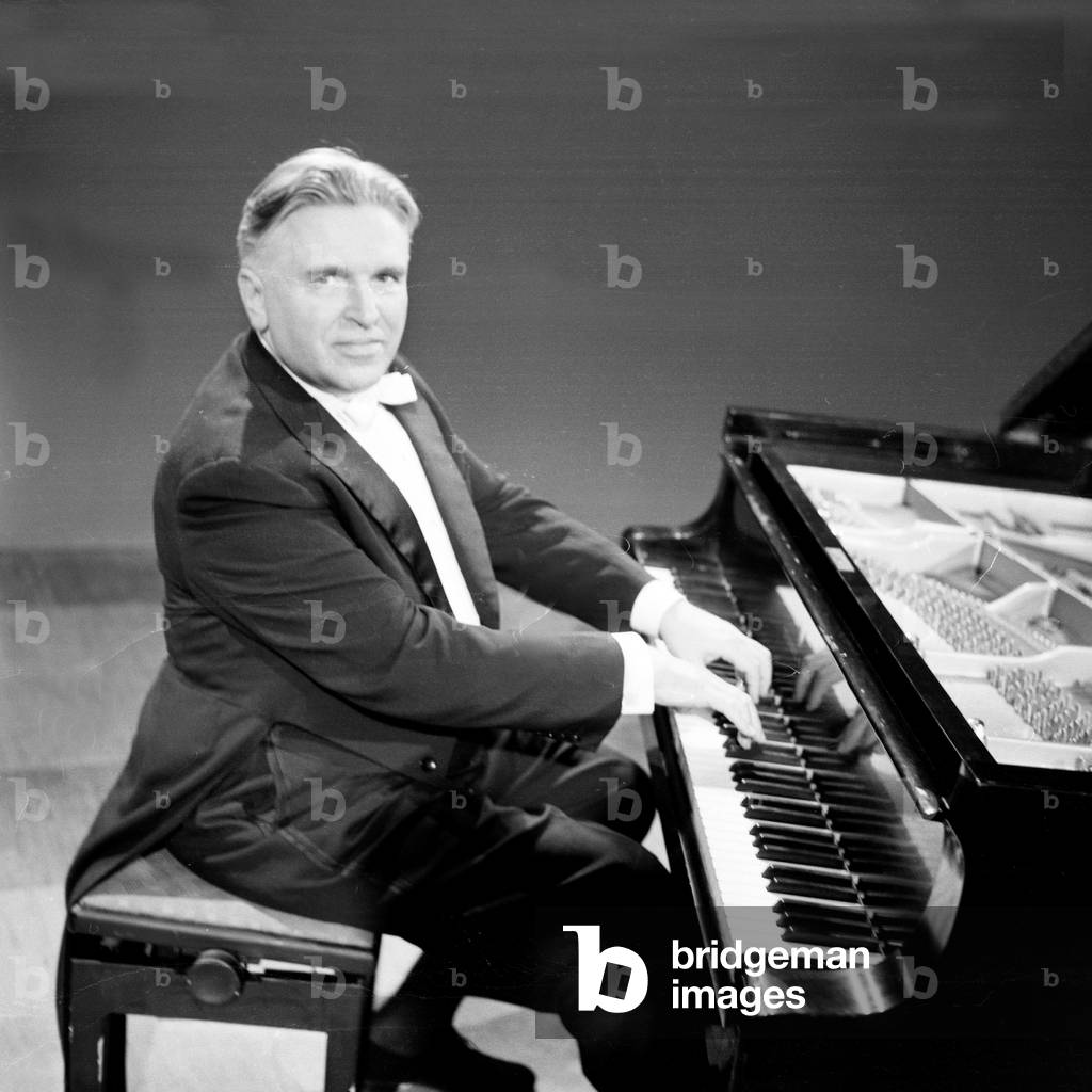 A pianist at his grand piano on stage of German TV and radio station Norddeutscher Rundfunk at Hamburg, Germany 1960s