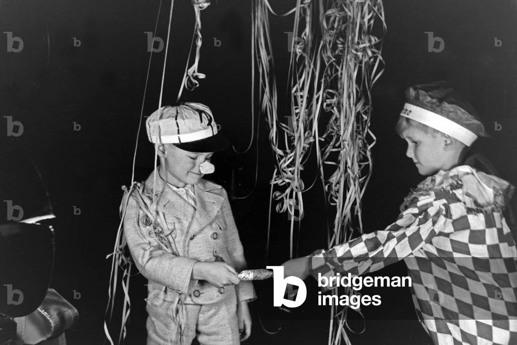 Two little boys dressed for a carnival, Germany 1930s (b/w photo)