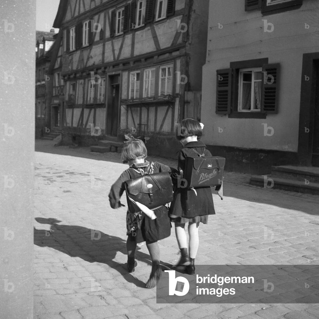 Two little girls on their way to school, Germany 1930s (b/w photo)