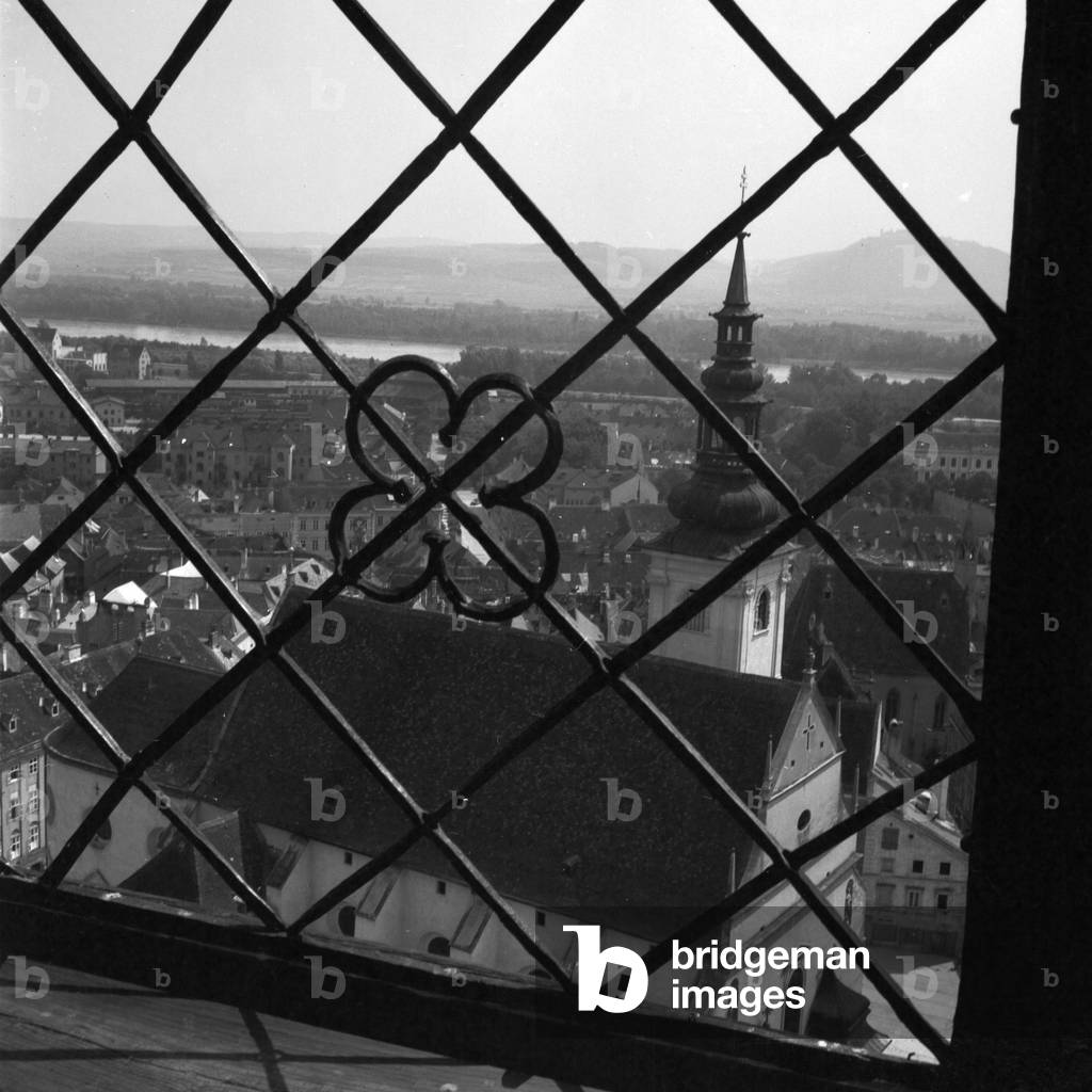View from the belfry of Frauenbergkirche church to St Nicholas church at Krems on river Danube, Austria 1930s (b/w photo)