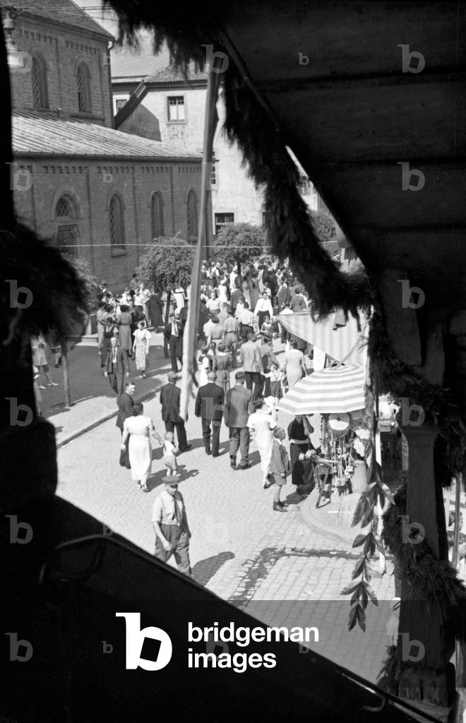 Annual radish fair carnival the the Kirchenstrasse street at Schifferstadt, Germany 1930s (b/w photo)