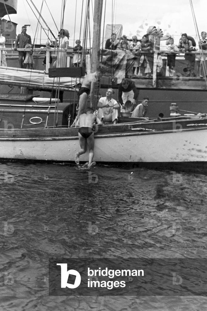 A steam ship landing on a pier at the Baltic Sea, Germany 1930s (b/w photo)