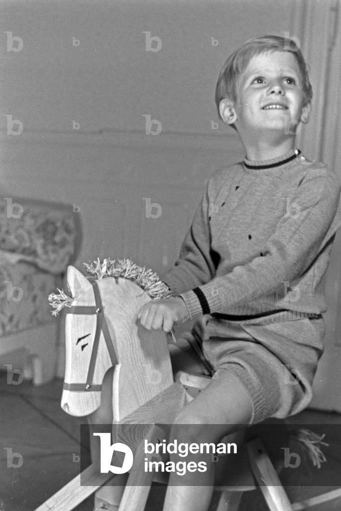 A little boy on his rocking horse, Germany 1930s (b/w photo)