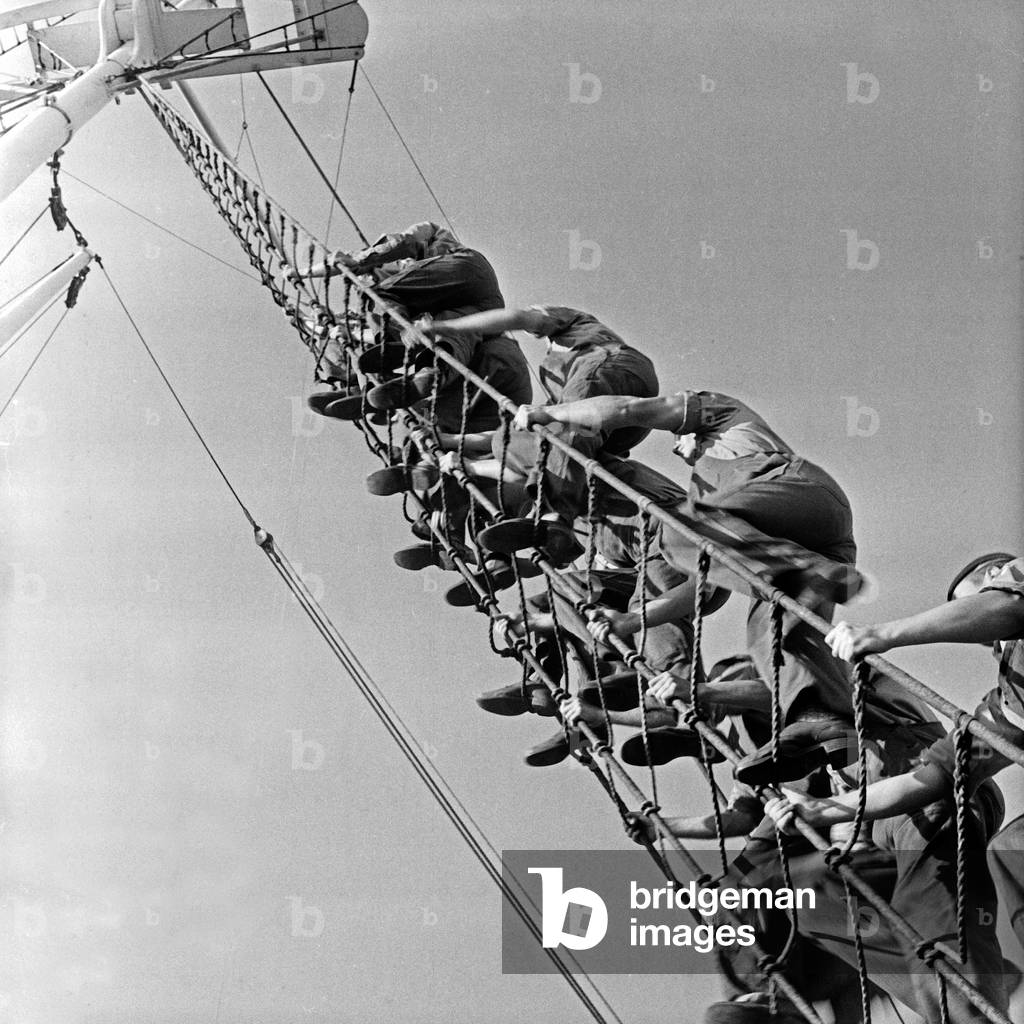 Pupils clambering aloft at the navigation school Falkenstein at Hamburg Blankenese, Germany 1950s