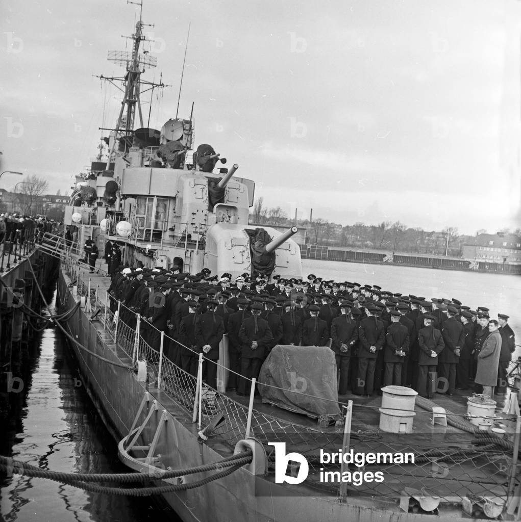 Crew of destroyer ship 172 of type 119 of German Federal navy on Deck at Kiel harbor, Germany 1960s