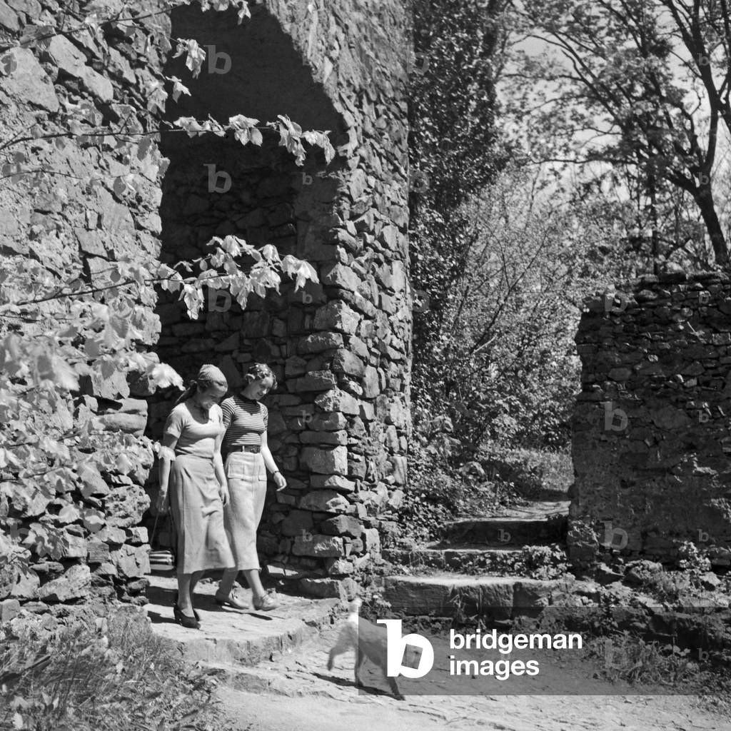 Two women walking the dog, Germany 1930s (b/w photo)