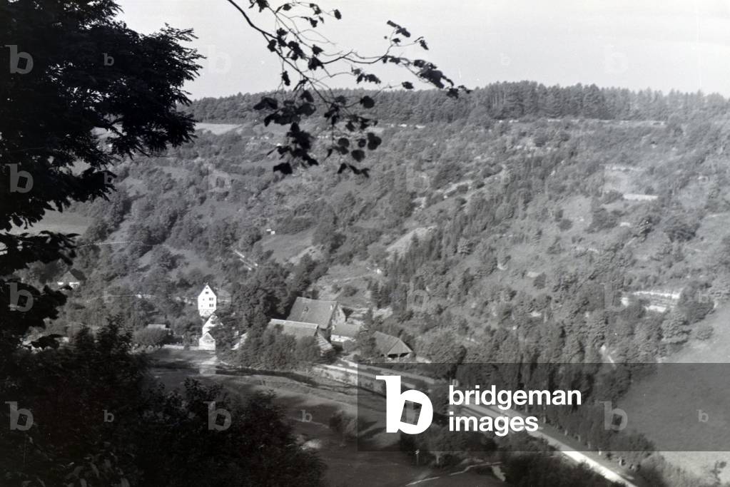 View of half-timbered houses of the town Rothenburg ob der Tauber embedded in a a beautiful natural landscape, Germany 1930s (b/w photo)