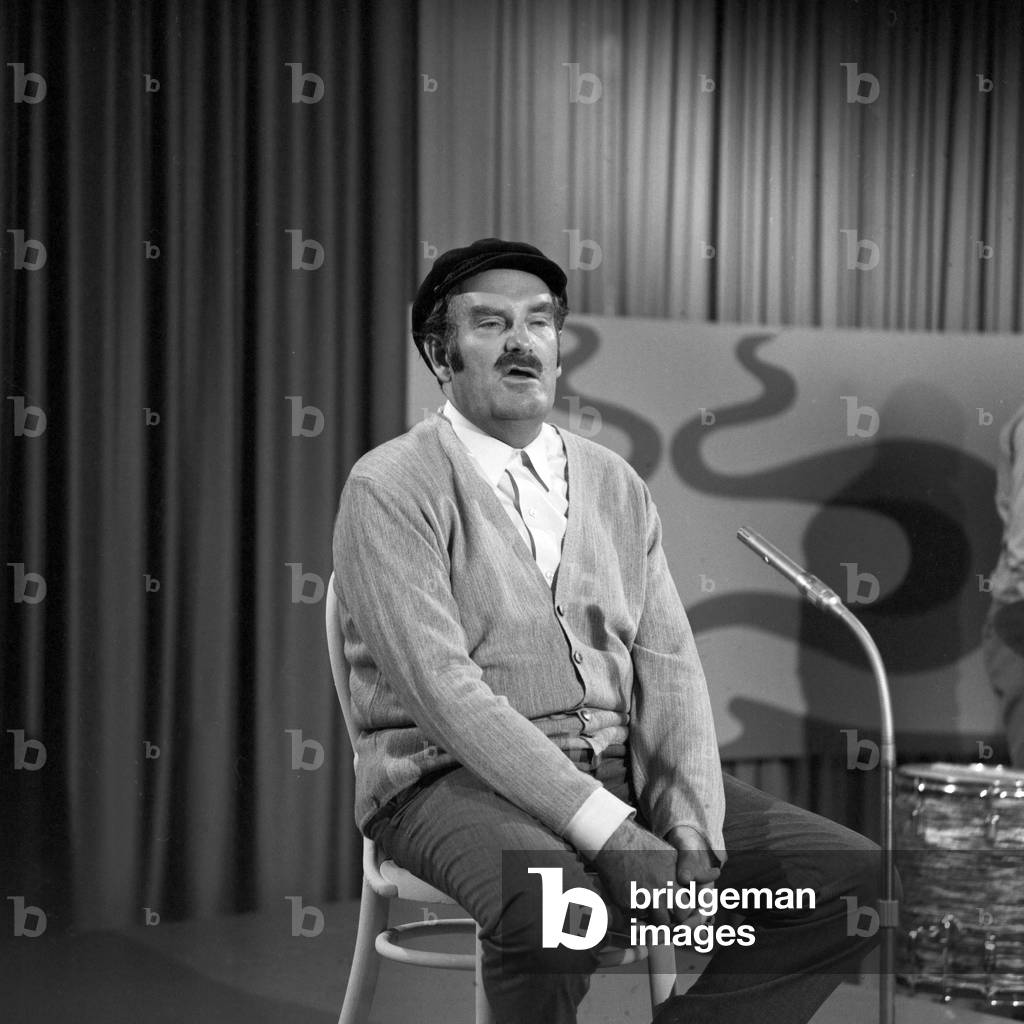 German cabaret artist and comedian Juergen von Manger in his programme on stage in December 1969