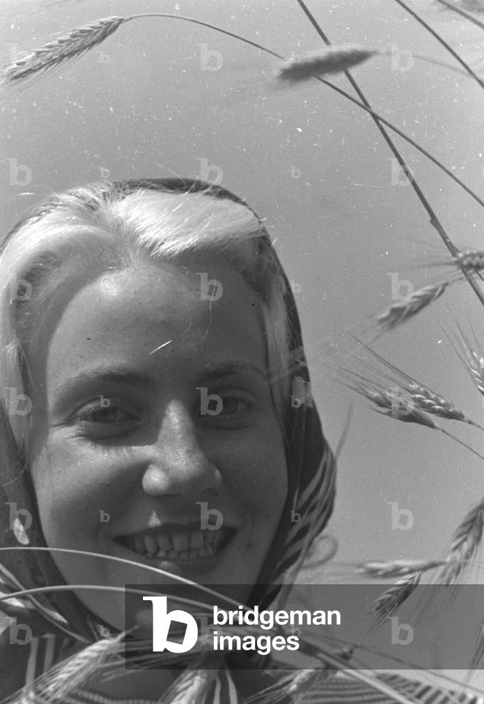 Young woman in a field, Germany 1930s (b/w photo)