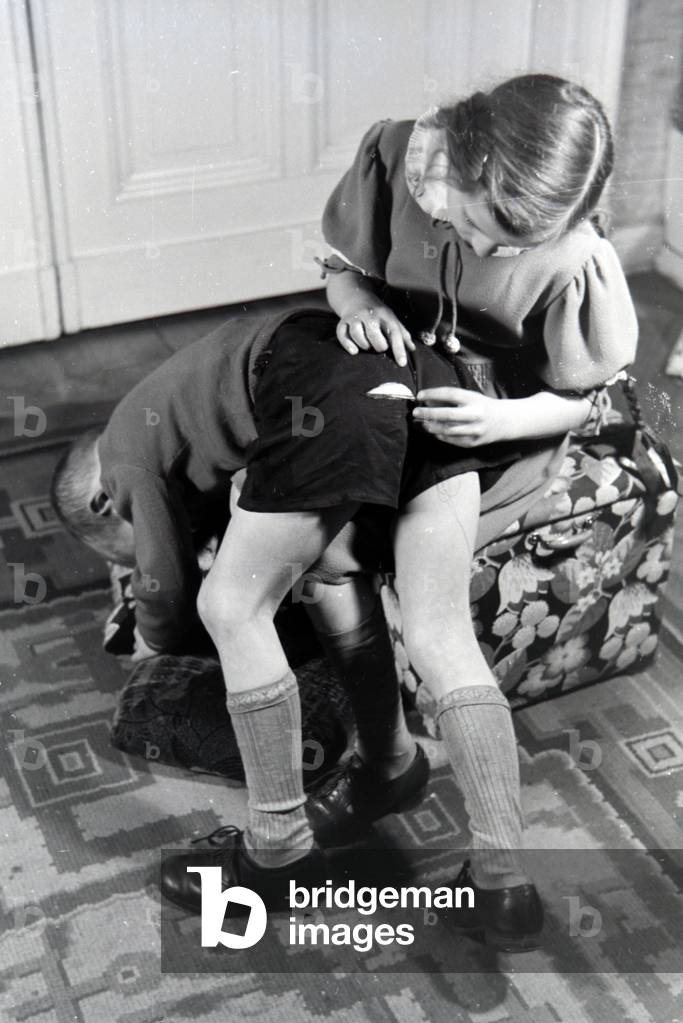 Members of an extended family helping one another, Germany 1930s