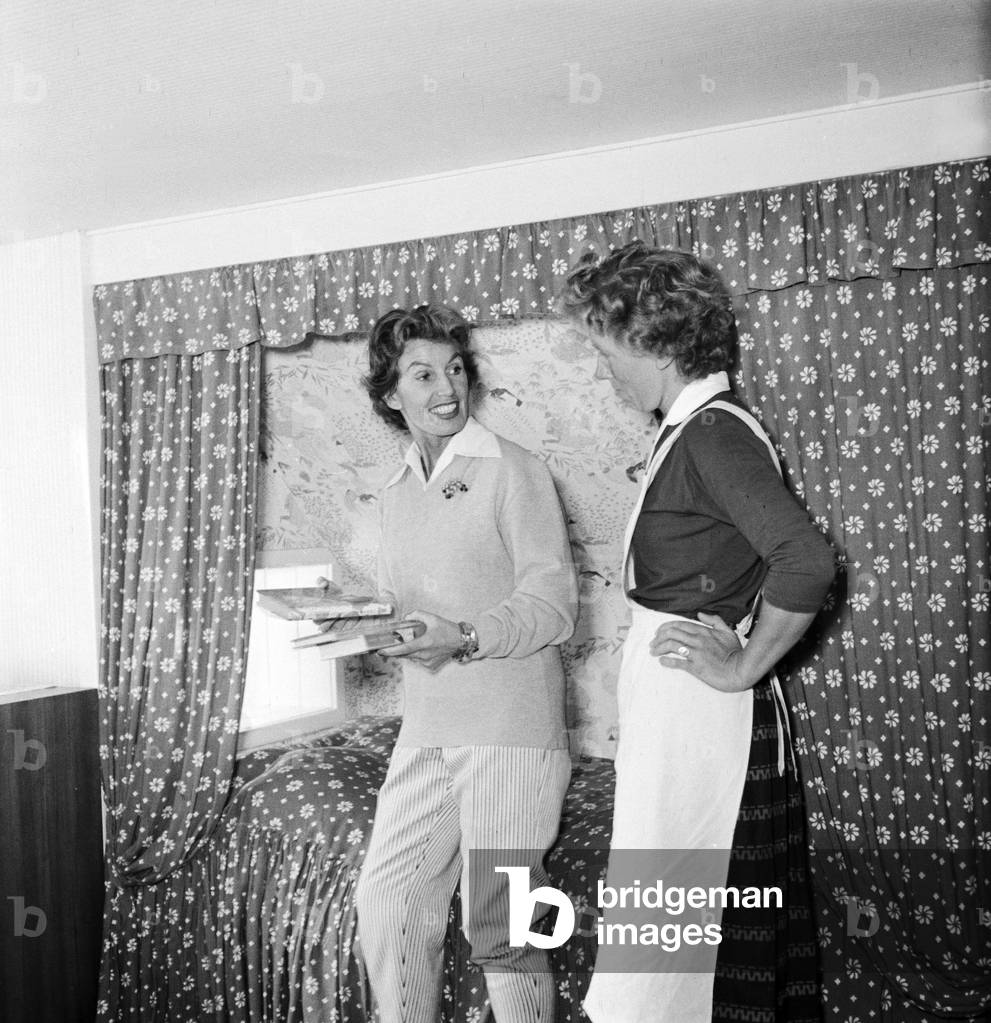 German singer and actress Lale Andersen and her housekeeper at her house, called Sonnenhof, on the East Frisian island Langeoog, mid 1957