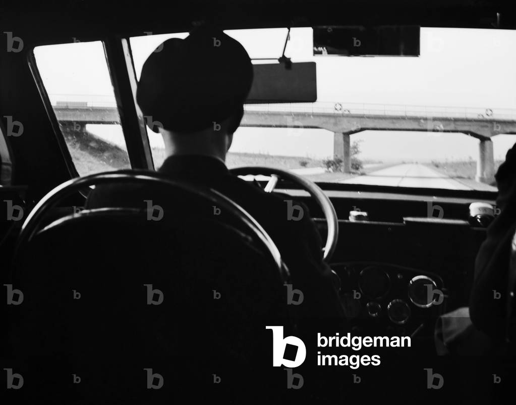 A bus on the highway near Halle at river Saale, Germany 1930s (b/w photo)