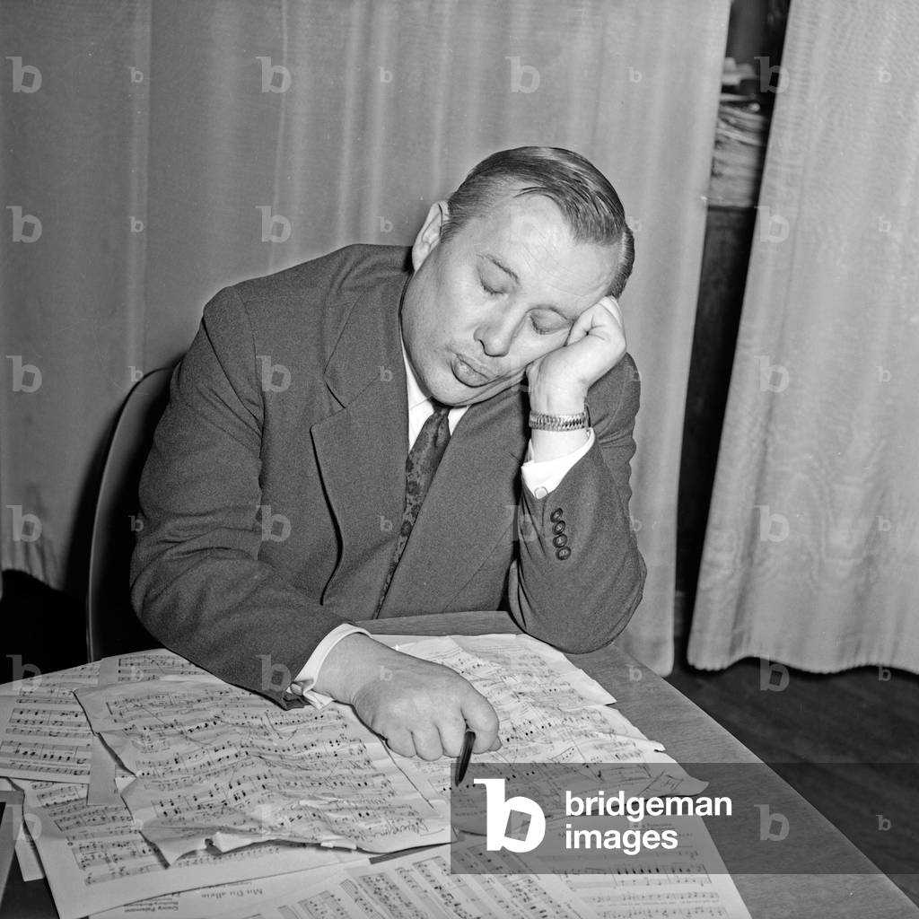 A composer trying to arrange a compsition at Hamburg, Germany 1950s