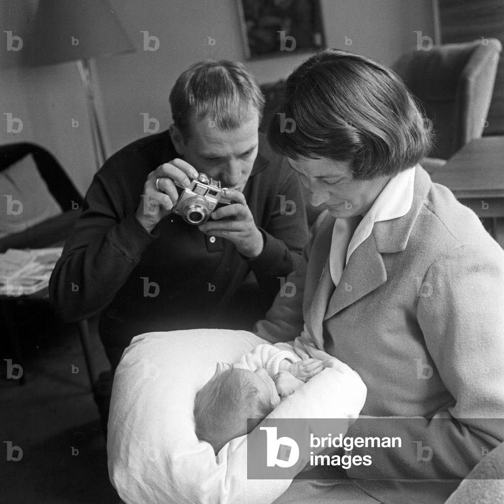 German TV and movie director Juergen Roland taking pictures of wife Eva and baby Kay at Hamburg, Germany 1950s
