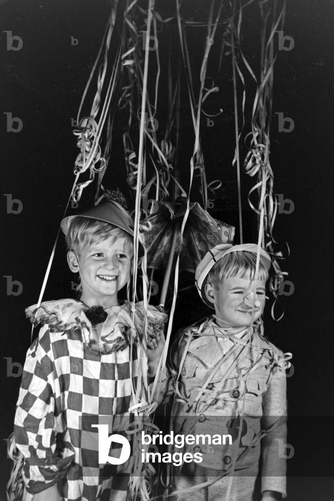 Two little boys dressed for a carnival, Germany 1930s (b/w photo)