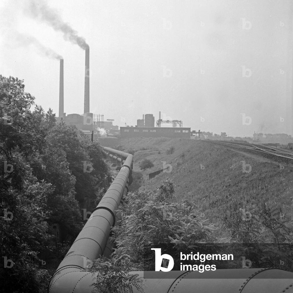 On the way to the industrial heart of the Ruhr area: pipeline at Duisburg, Germany 1930s (b/w photo)