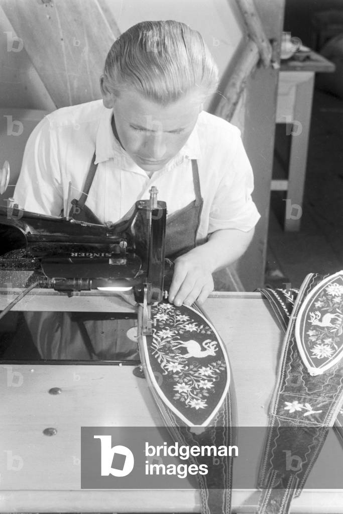 A tailor from Bad Tölz making Lederhosen, Germany 1930s (b/w photo)