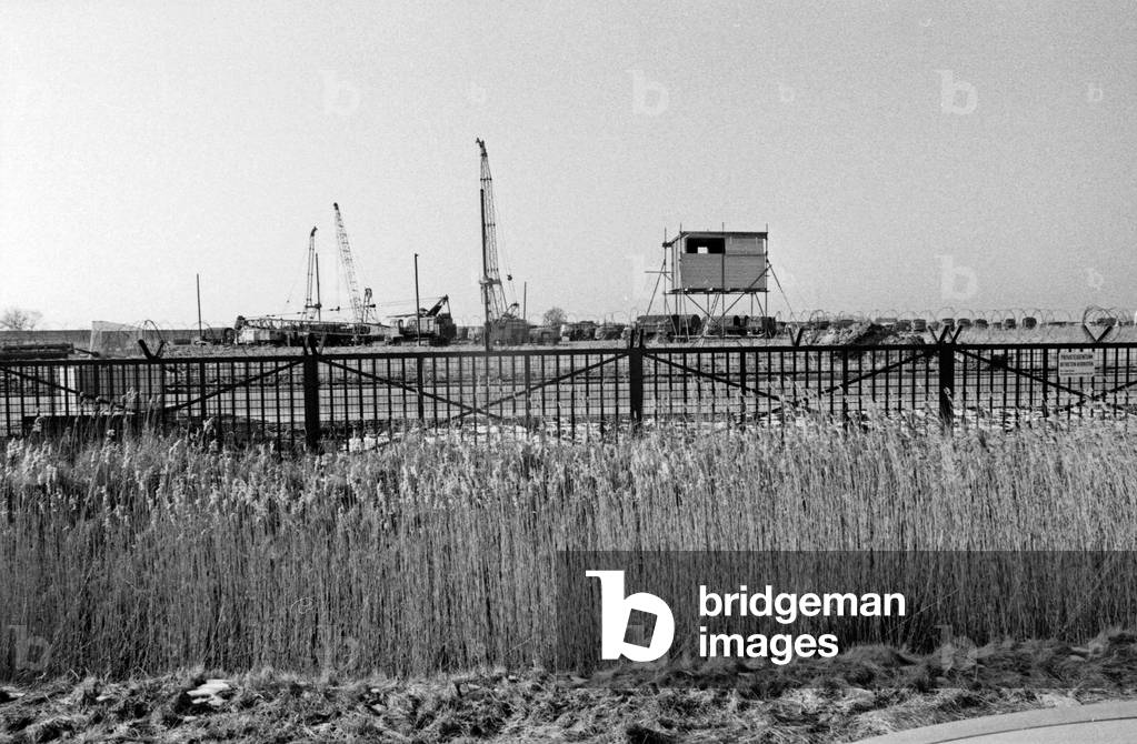 Police trucks behind the fence of Brokdorf nuclear plant, Germany 1980s